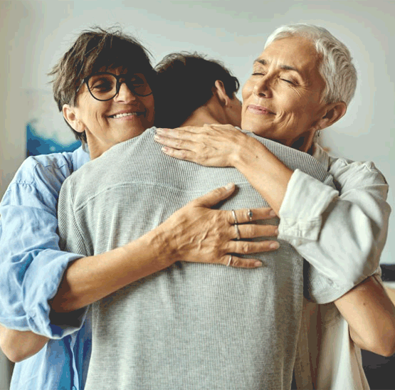People embracing during a supportive mental health moment